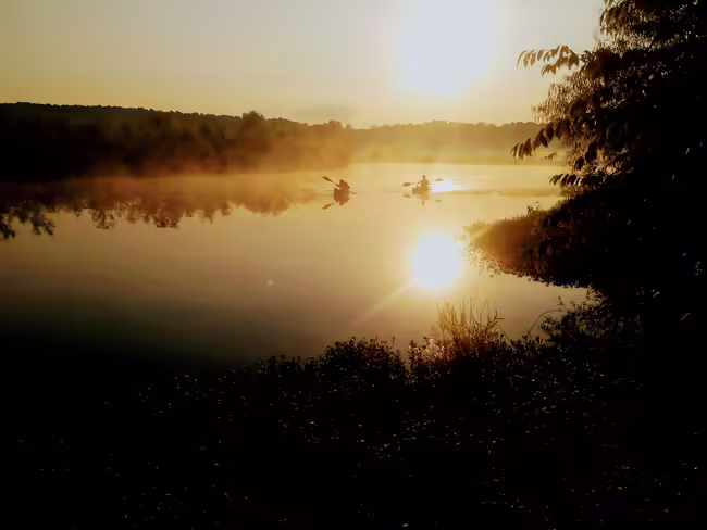 Two kayaks on a lake