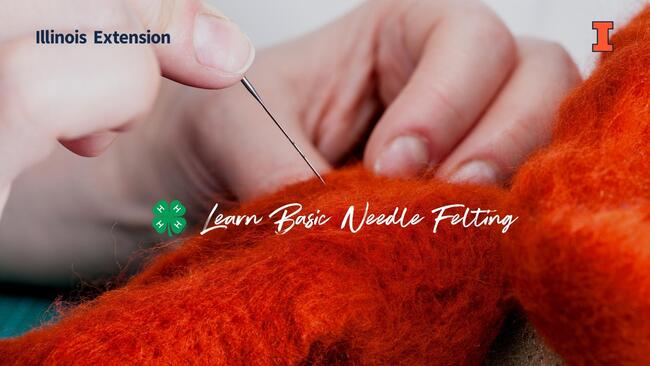 hands holding felting needle working with bright orange wool