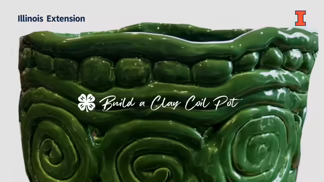close up of a green clay coil pot