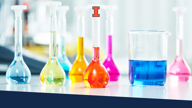 Lab beakers with different colors of chemicals in them. 