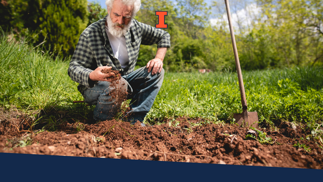 An older gentleman holding soil in his hand and letting it fall through his hands to a patch of soil underneath.