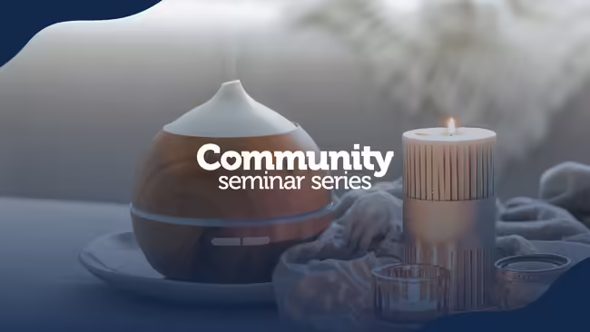 aromatherapy diffuser next to glowing candle