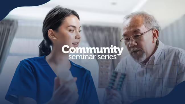 Healthcare professional explaining medication to older adult patient
