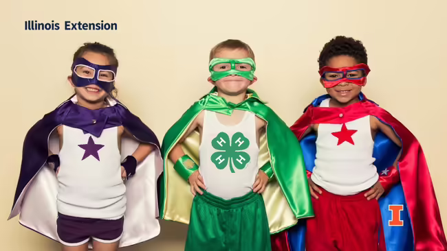 young children dressed as superheroes