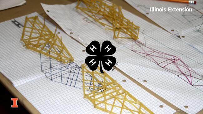 close up of bridge sketches and bridge models made of linguine pasta