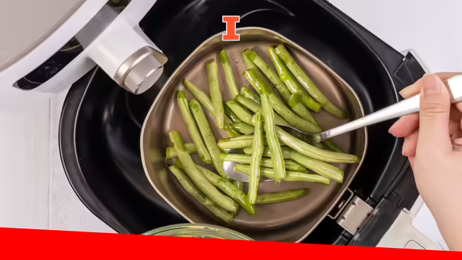 Cooking grenn beans in an air fryer.
