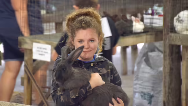 girl holding a rabbit