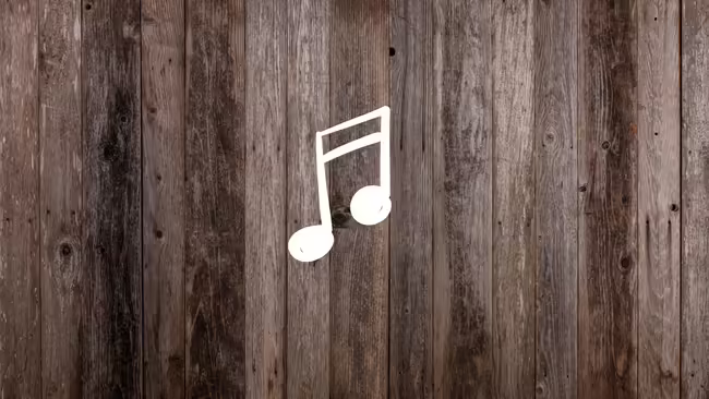 Barn wood with a graphic of a music note.