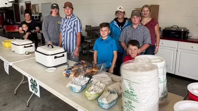 4-H members ready to serve guests at the BBQ