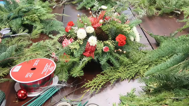 evergreen centerpiece on a work table