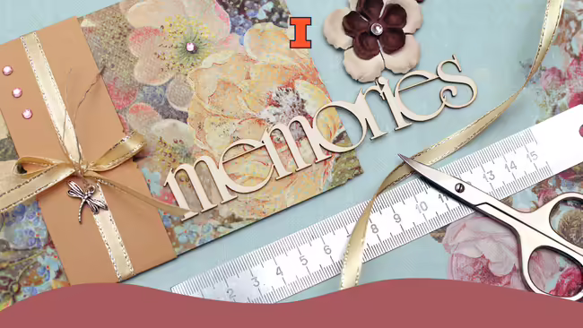 Scrapbook items and tools laid out on a table.