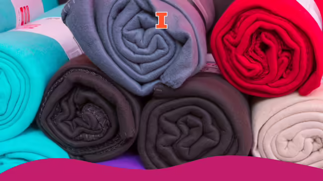 Fleece blankets rolled up tightly in a circle.
