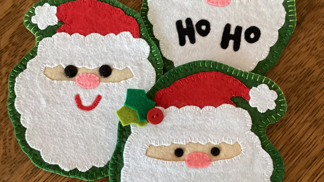 wool felt sewn into Santa shapes