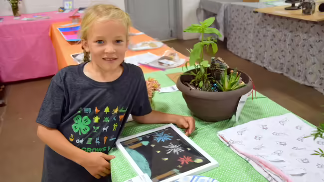 4-H cloverbud with her project