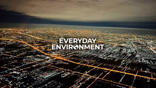 everyday environment over lit up city overhead at night