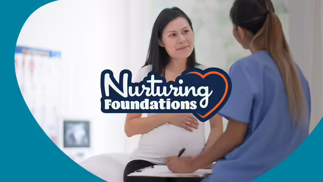 Pregnant woman talking with a health care provider