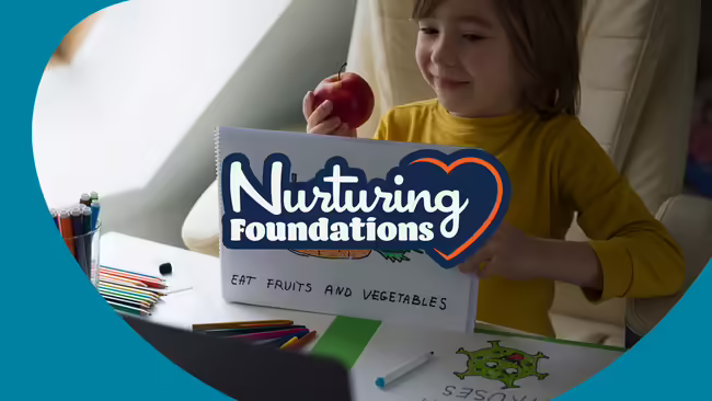 A child eating an apple and reading something