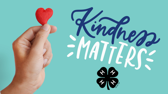 A hand holding a red felt heart between its fingers. Black 4-H clover logo. Text reads Kindness Matters.