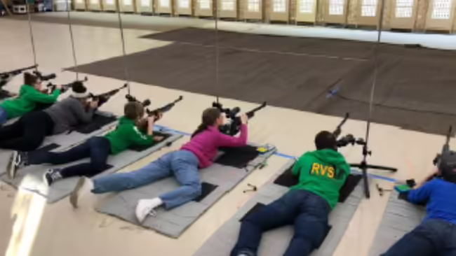 Youth shoot on a range.