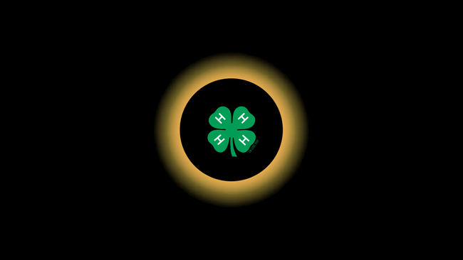 Image of a solar eclipse with a 4-H emblem in the center.
