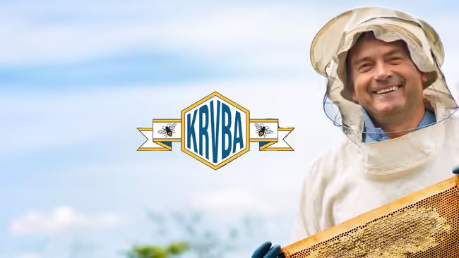 beekeeper holding hive frame