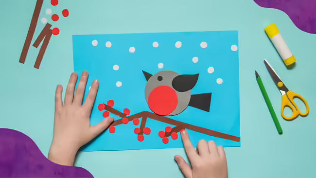A paper craft of a bird on a piece of paper.