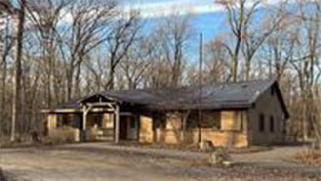 Brown building with trees around it