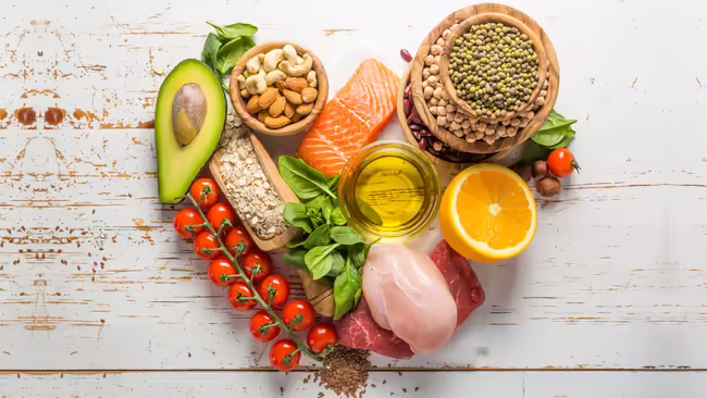 A variety of heart healthy foods arranged in a heart shape