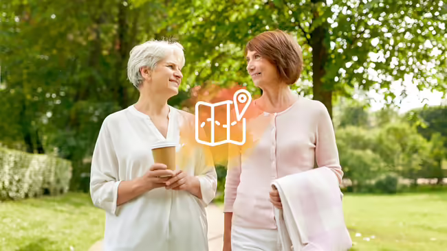 Two senior women walking together.