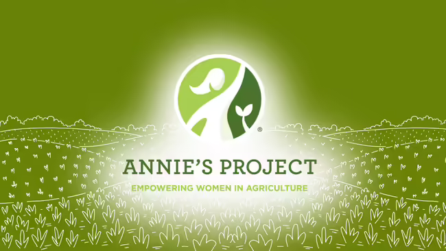 circular emblem lit up over a green background