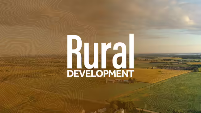 Image of crop fields with the text Rural Development over it.
