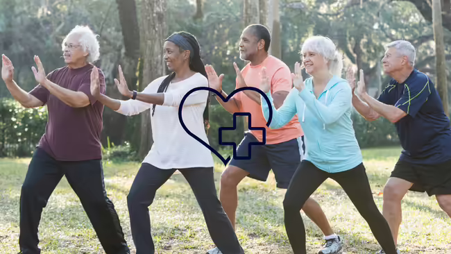 Image of a group of people doing tai chi with a graphic of a heart and cross.
