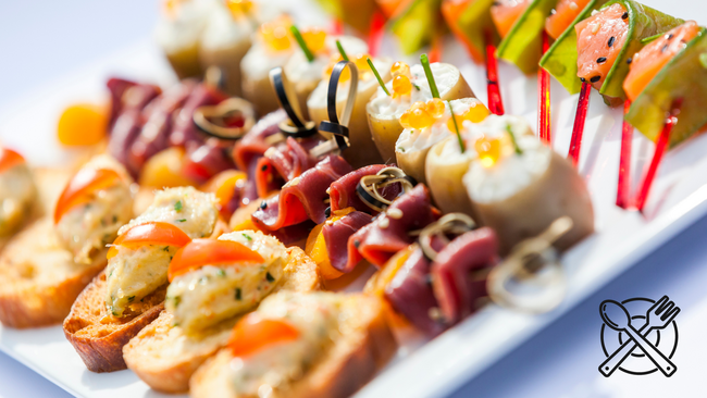 Various types of appetizers sitting on a serving platter.