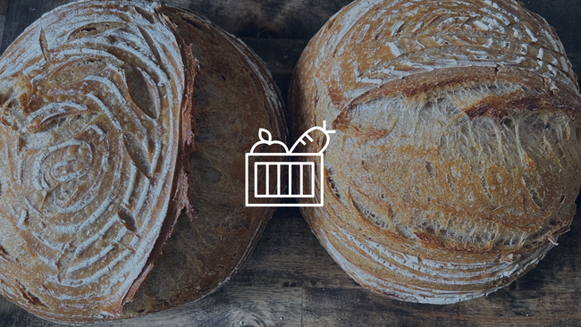 Image of two loaves of bread with a graphic of a produce basket