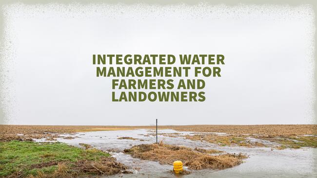 A view of a water sediment control basin in flowing waters through a farm field.