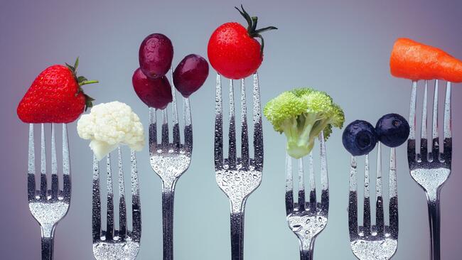 Building Better Bites, forks with fruits and vegetables pictured