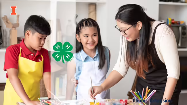 adult woman and two kids in aprons with art supplies and paints in front of them