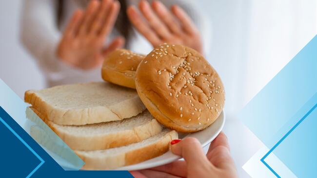 Gluten Free: Facts and Fads, person putting up their hands to a plate full of sandwich bread and buns pictured