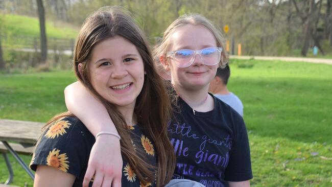 two little girls outside at a park