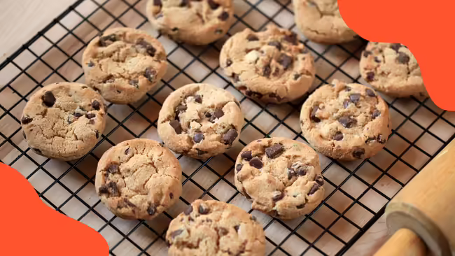 cookies on a cooling rack with orange graphics in the corners.