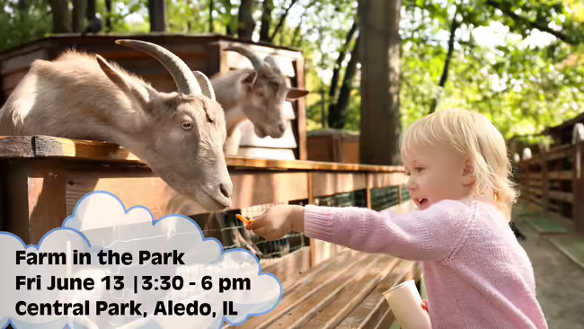 Girl feeding two goats Farm in the Park Fri June 13 3:30 - 6 pm Central Park, Aledo, IL