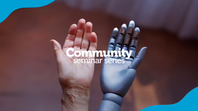A human hand and a robot hand.