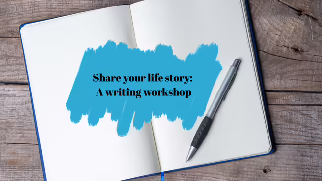 An opened blank notebook with a pen laying on top of it.