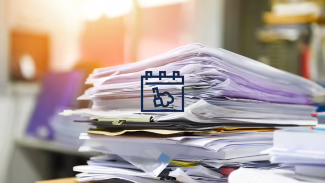 A stack of papers with a broom logo