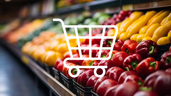 shopping cart icon in front of picture of fresh produce in store