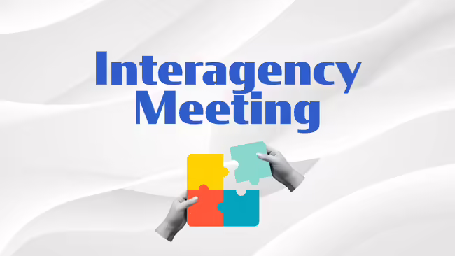 hands putting multi-colored puzzle pieces together