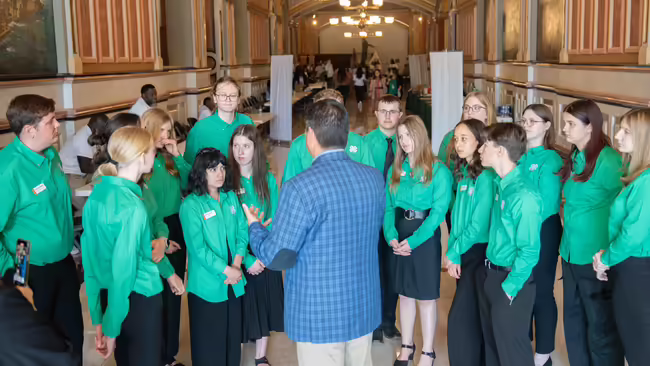 Trained youth listen at the Capitol.
