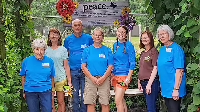 group of people in blue shirts