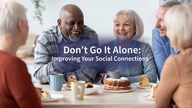 A group of older adults talking over coffee and pastries