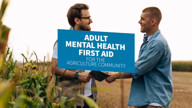 Two men shaking hands in a farm